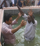 A new believer is baptized at a church in Kerala, India.