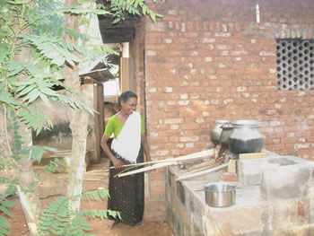 A staff member prepares food in an outside kitchen at one of the Christian orphanages in India.
