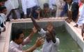 A new believer is baptized.